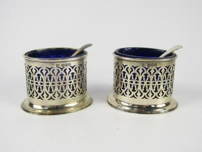 A pair of George V silver pierced oval salts