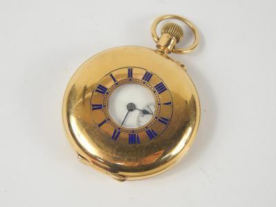 An 18ct gold gentleman's half hunter cased keyless wind pocket watch, enamel dial bearing Roman numerals, subsidiary seconds dial, back cover monogram engraved, Birmingham 1910, 100g all in.