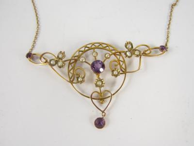 A 9ct gold amethyst and seed pearl floral pendant on chain