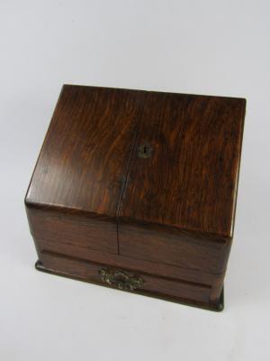 A Victorian oak stationery rack