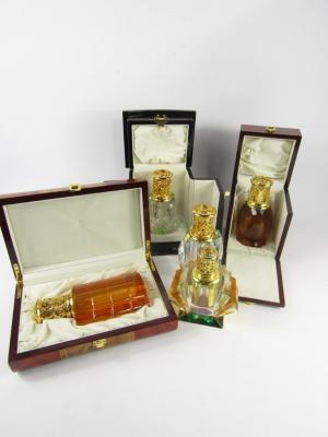 Three cut glass and brass fragrance lamps