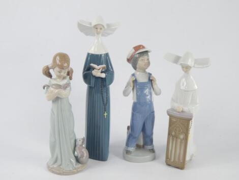 Four Lladro porcelain figures