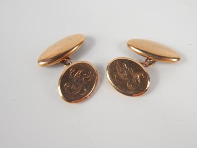 A pair of 9ct gold oval cufflinks