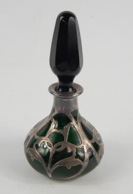 An early 20thC green glass scent bottle and stopper