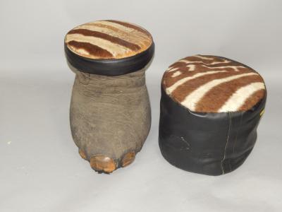 An elephant's foot stool with a zebra skin top