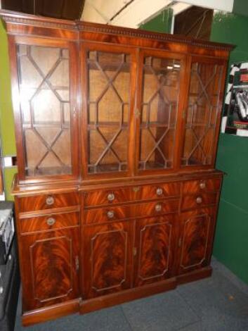 A reproduction mahogany breakfront secretaire bookcase