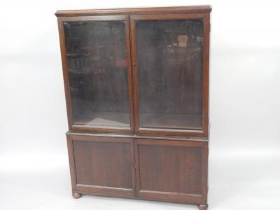 An oak cupboard bookcase