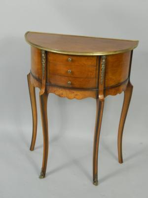 A French burr yew and brass overlaid demi lune side table