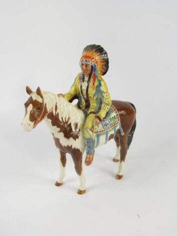 A Beswick figure of an Indian Chief mounted on a skewbald horse