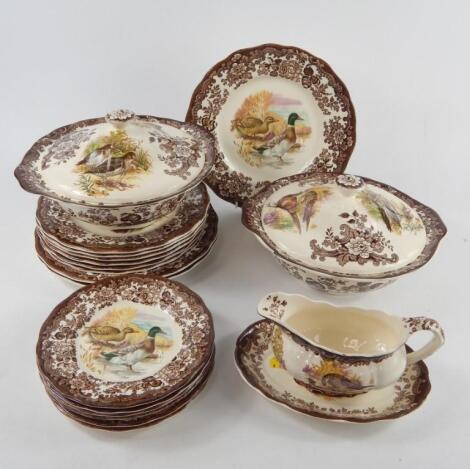 A Palissy pottery part dinner service decorated with game birds