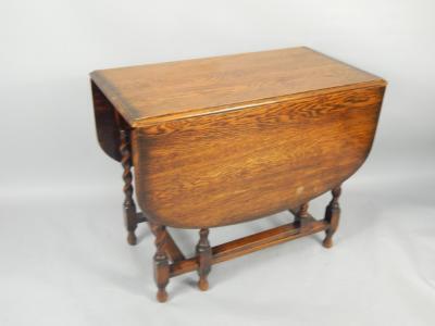 A 1930's oak gateleg dining table