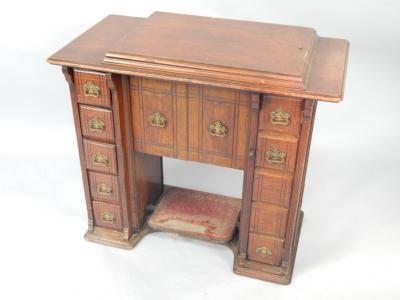 A Singer oak cased treadle sewing machine