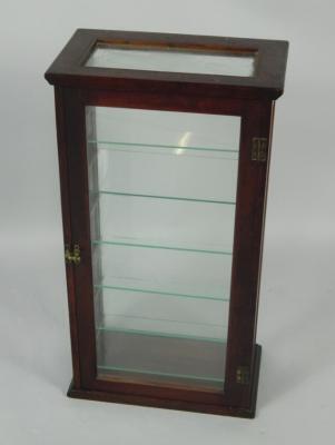 A glazed mahogany display case