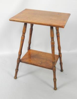 An oak two tier occasional table