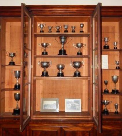 A collection of silver and plated tennis trophies to N de Manby