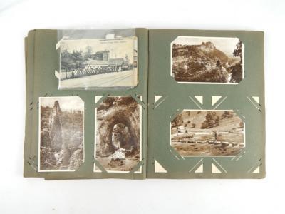 An album of Edwardian and later sentimental and topographical postcards.