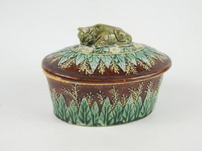 A late 19thC Majolica potted meat dish and cover