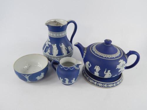 A Wedgwood dark blue Jasperware teapot on stand