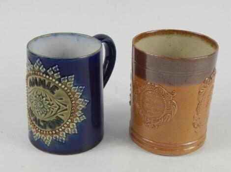 A Doulton Lambeth stoneware mug named to Annie Walton