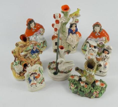 A pair of 19thC Staffordshire pottery figures of Little Red Riding Hood