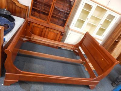 A Willis & Gambier pale mahogany double sleigh bed.