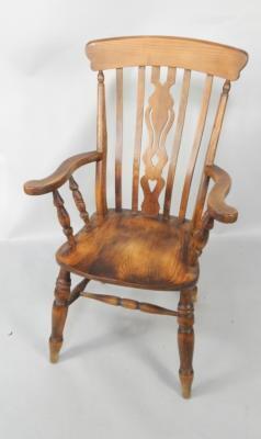 An oak country lath back armchair