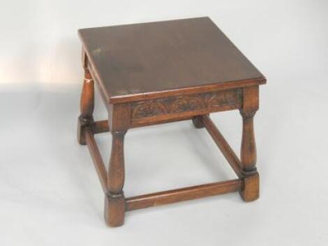 An oak square top low occasional table