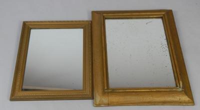 A Victorian gilt wood cushion wall mirror