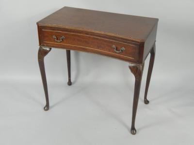 A mahogany inverted bow front side table