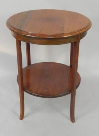 A Victorian mahogany and boxwood line inlaid circular two tier occasional table