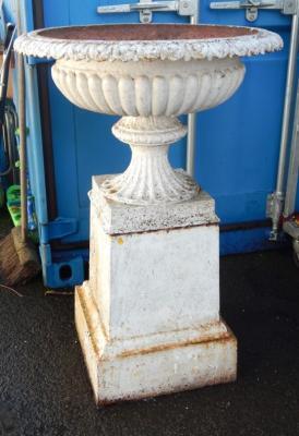 A Victorian cast iron semi fluted garden urn