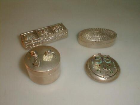 A group of four silver pill boxes including one marked for Asprey