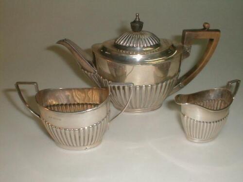 An Edwardian/Victorian silver composite three piece tea service