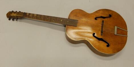 An American Harmony acoustic guitar