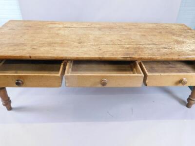 A large 19thC pine kitchen table - 2