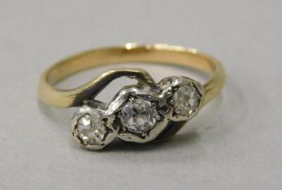 A three stone diamond twist ring