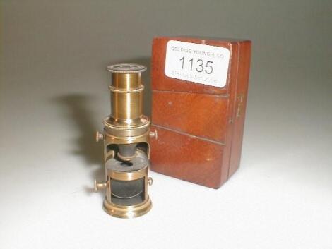 A 19thC mahogany cased miniature monocular microscope