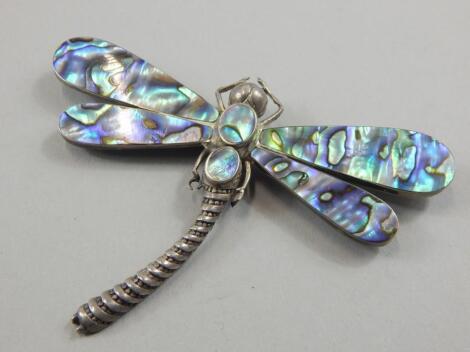 A silver and mother of pearl dragonfly brooch