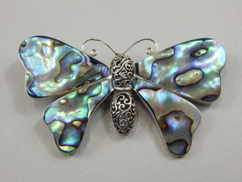 A silver and mother of pearl butterfly brooch