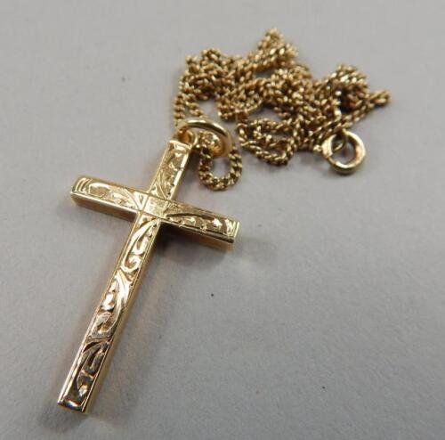 A 9ct gold crucifix pendant and chain