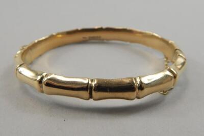 A 9ct gold bangle