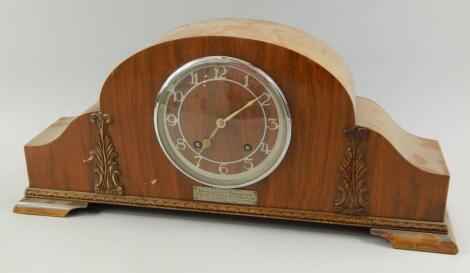 A 1950's walnut cased mantel clock