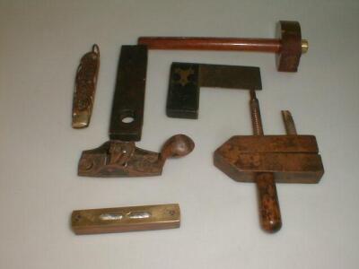 A group lot of wood working tools including a miniature thumb plane