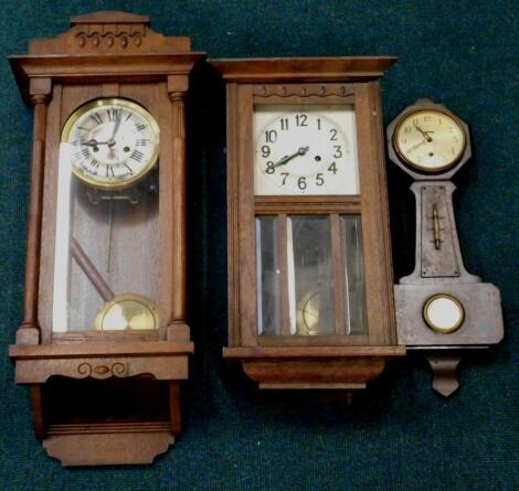 An early to mid 20thC oak wall clock