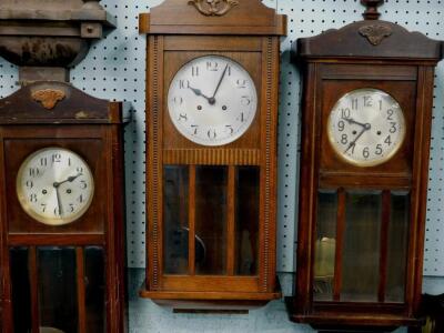 Three early to mid 20thC oak cased wall clocks