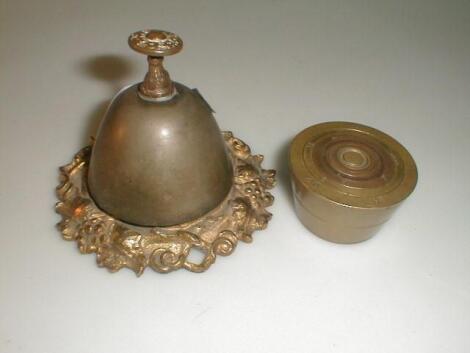 A set of brass cup weights and a table bell (2)