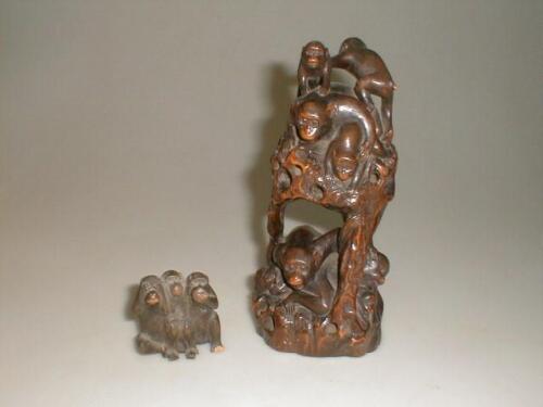 A Japanese carved hardwood group of monkeys