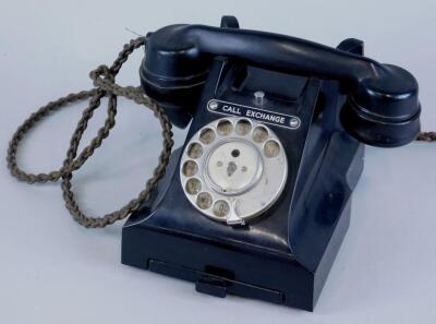 A black Bakelite telephone