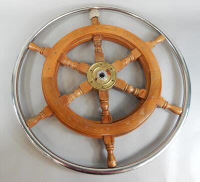 A teak and chrome plated ship's wheel