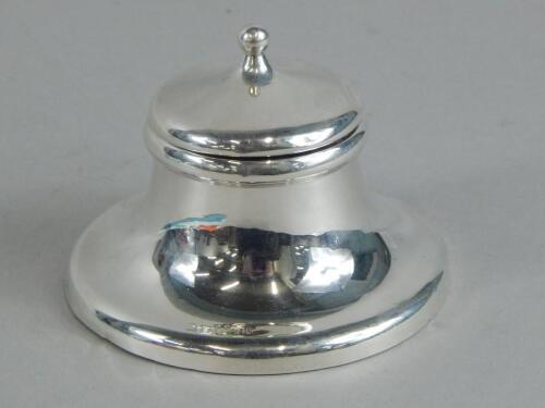 A silver Capstan type inkwell